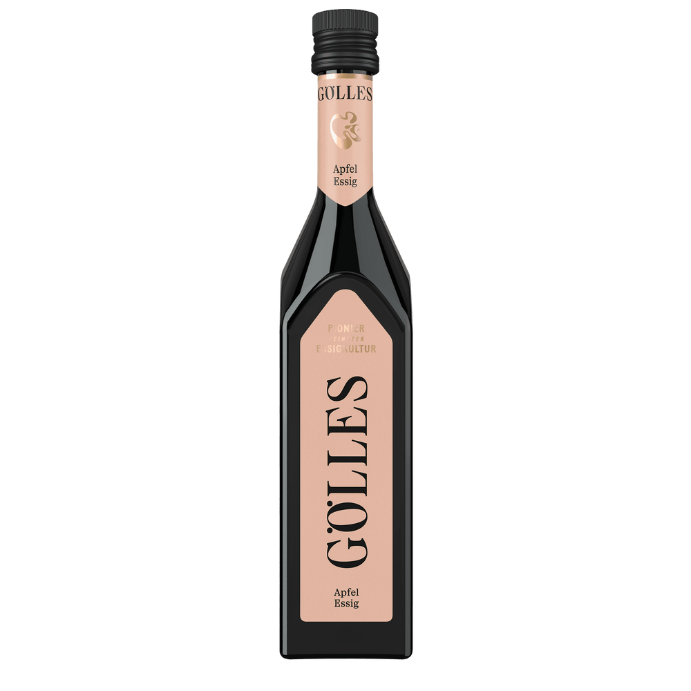 Gölles Apfel Essig in hoher Glasflasche mit rosa Etikett und schwarzem Verschluss.