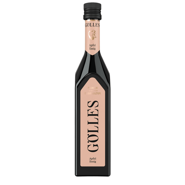 Gölles Apfel Essig in hoher Glasflasche mit rosa Etikett und schwarzem Verschluss.