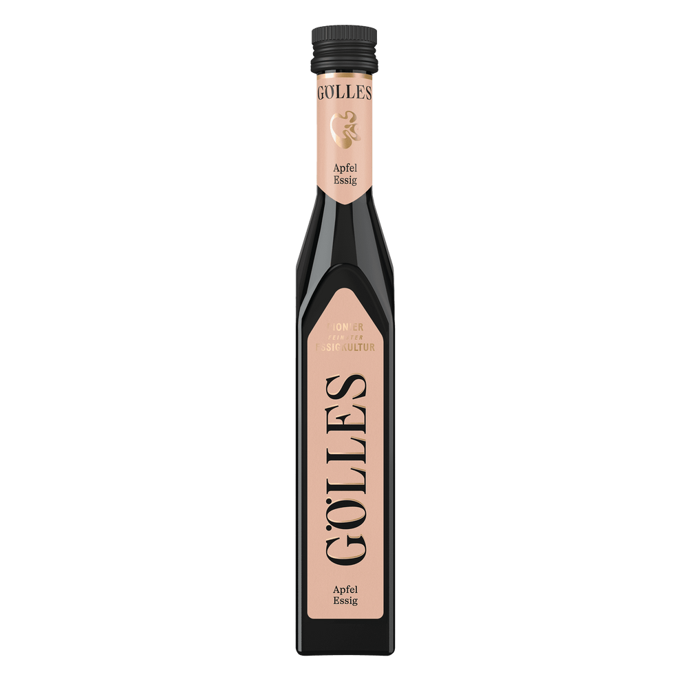 Gölles Apfel Essig in hoher Glasflasche mit rosa Etikett und schwarzem Verschluss.