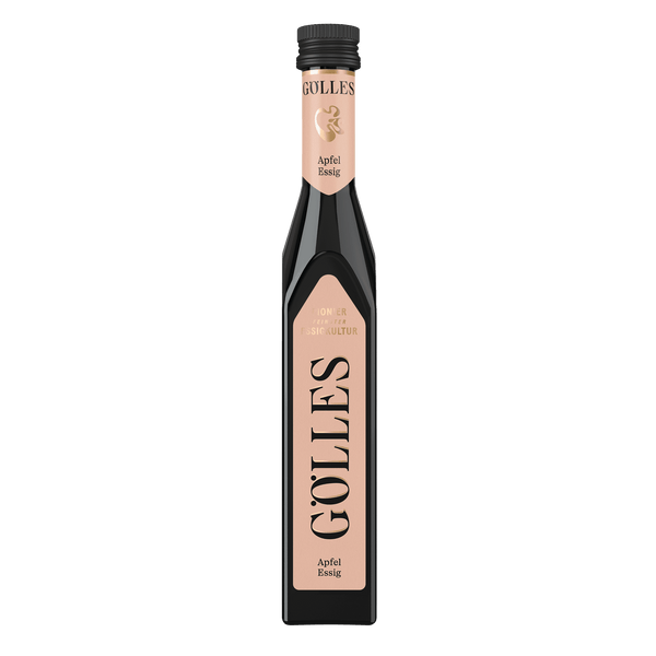 Gölles Apfel Essig in hoher eckiger Flasche mit pfirsichfarbenen Etiketten.