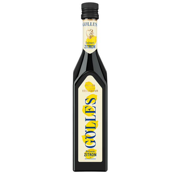 Gölles Balsam Zitron in hoher Flasche, Etikett mit gelben Zitronenillustrationen.