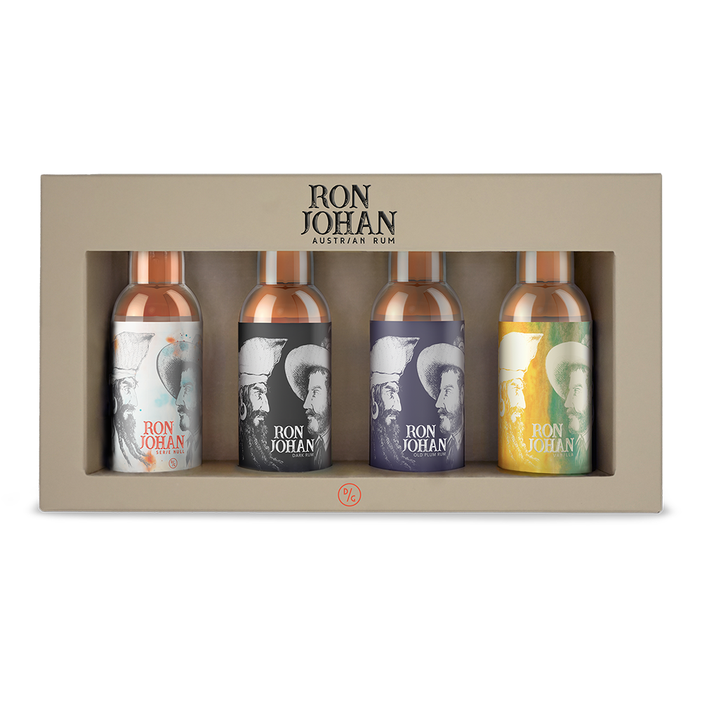DAVID GÖLLES Best of Rum: Geschenkbox mit vier kleinen Flaschen Ron Johan Rum mit illustrierten Etiketten.