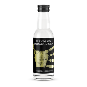 DAVID GÖLLES HANDS ON Organic Gin in kleiner Flasche mit schwarzem Etikett und goldenem Handabdruck.