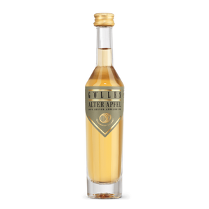 Gölles Apfelbrand Alter Apfel in Klarglasflasche mit goldenem Schraubverschluss und goldenem Etikett.