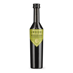 Gölles Birnenbrand Williams in schmaler schwarzer Flasche mit hellgrünem Schildetikett.