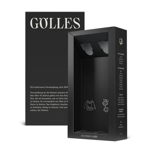 Leere schwarze Gölles Geschenkbox für zwei Flaschen mit Herzmotiv im Inneren.