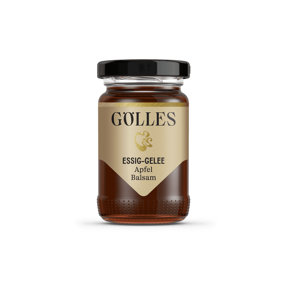 Gölles Essiggelee Apfel Balsam, dunkel bernsteinfarben, in kleinem Glas mit schwarzem Deckel.