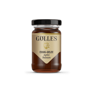 Gölles Essiggelee Apfel Balsam, dunkel bernsteinfarben, in kleinem Glas mit schwarzem Deckel.