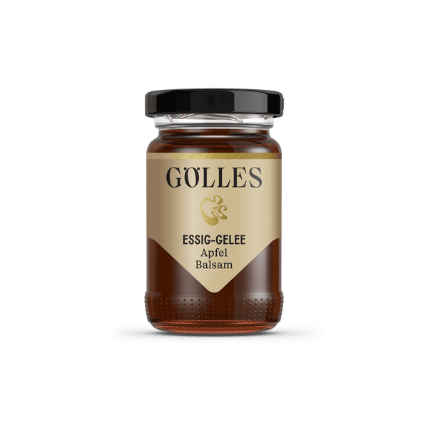 Gölles Essiggelee Apfel Balsam, dunkel bernsteinfarben, in kleinem Glas mit schwarzem Deckel.
