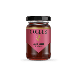 Gölles Essiggelee Himbeer, dunkelrot, in Glas mit schwarzem Deckel und rosa Etikett.