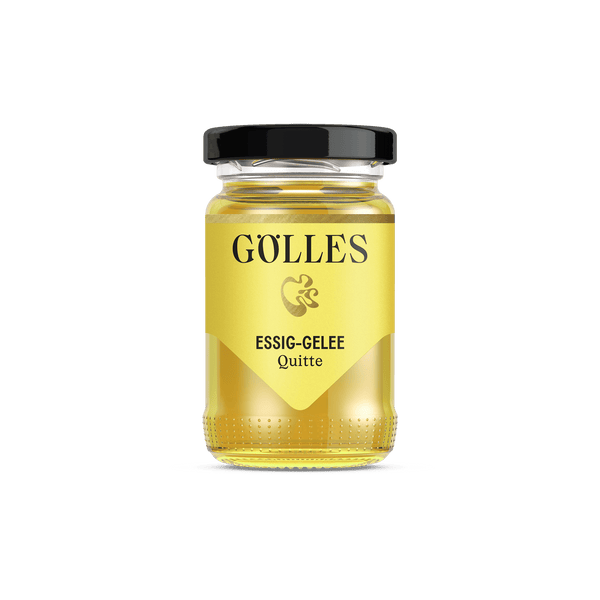 Gölles Essiggelee Quitte, gelb, in Glas mit schwarzem Deckel.