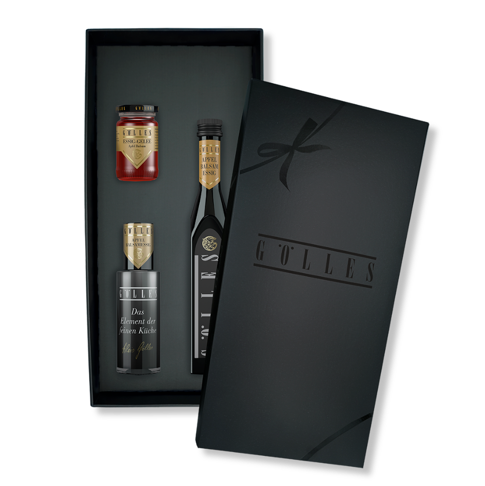 Gölles Set Apfel Balsam Trio: schwarze Geschenkbox mit Essiggelee und zwei Flaschen Apfel Balsamessig.