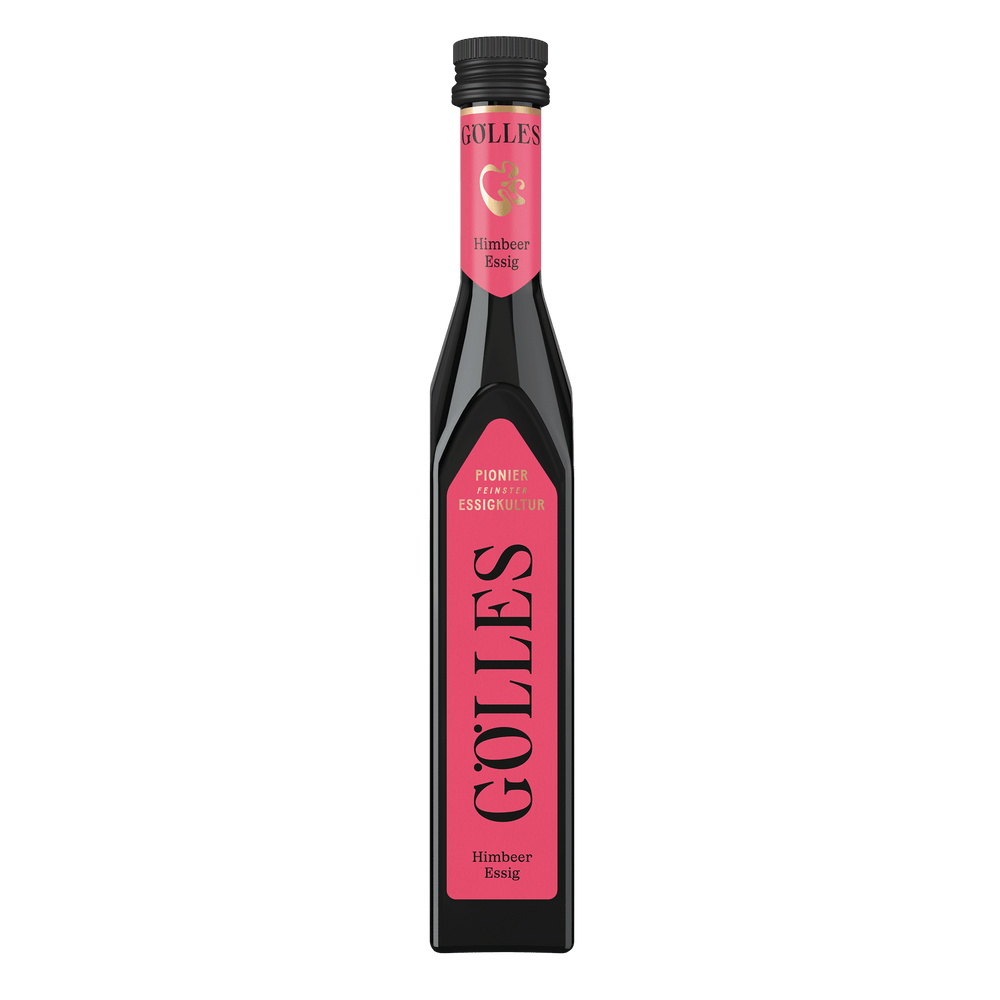 Gölles Himbeer Essig in schlanker eckiger Flasche mit rosa Etikett und schwarzem Verschluss.