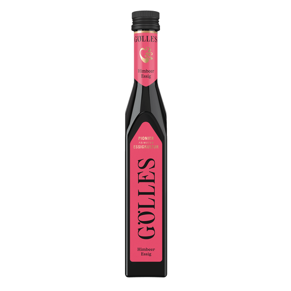 Gölles Himbeer Essig in schlanker eckiger Flasche mit rosa Etikett und schwarzem Verschluss.