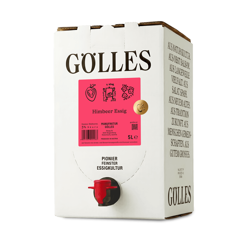 Gölles Himbeer Essig in schlanker eckiger Flasche mit rosa Etikett und schwarzem Verschluss.