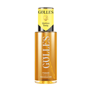 Gölles Quitten Essig, goldgelb, in hoher Glasflasche mit gelbem Halsetikett.