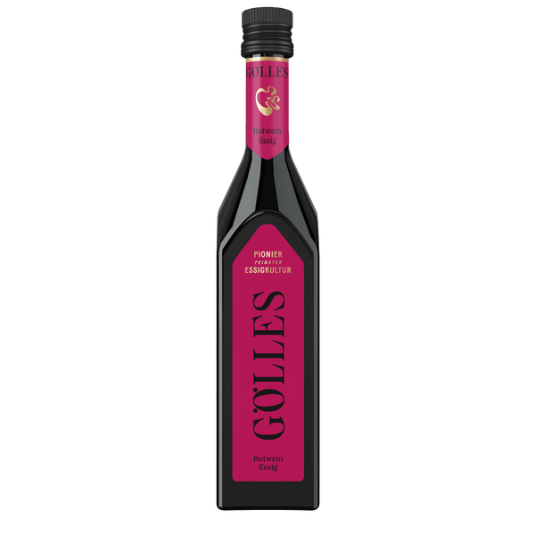 Gölles Rotwein Essig in eckiger Flasche mit pinkfarbenem Etikett und schwarzem Verschluss.