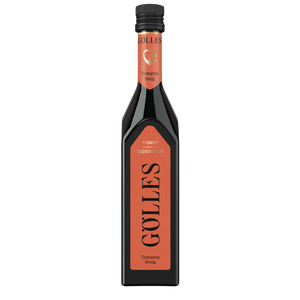 Gölles Tomaten Essig in eckiger Flasche mit rotem Etikett und schwarzem Verschluss.