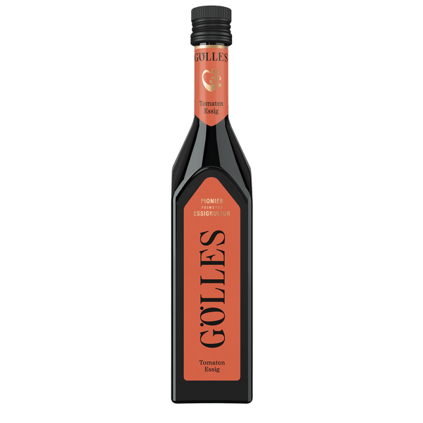 Gölles Tomaten Essig in eckiger Flasche mit rotem Etikett und schwarzem Verschluss.